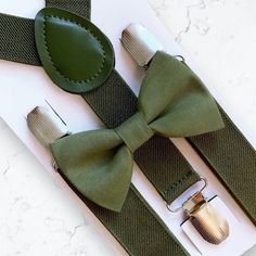 Olive Green Bow Tie & Olive Suspenders- The Perfect Wedding Look! Our olive bow tie & suspenders is a great choice for family photos, wedding, ring bearer outfit, birthday celebration or any other special occasion. ❤ **Please Specify Above**  SET- Bow Tie and Suspenders SUSPENDERS- One Pair of our Quality Suspenders BOW TIE- One Bow Tie on white elastic strap or alligator clip Small: 9 months- 4 years *Bow Tie: 3.5in wide *Suspenders: Elastic, Y Back, 16in- 27in Medium: 5 years- 12 years *Bow Ti Groom's Bow Tie With Suspenders, Classic Wedding Belts And Suspenders With Bow Tie, Elegant Adjustable Belts And Suspenders For Wedding, Dapper Suspenders For Wedding, Adjustable Bow Tie For Groom, Dapper Wedding Suspenders, Classic Adjustable Bow For Groom, Adjustable Bow For Groom, Dapper Adjustable Bow Tie For Weddings