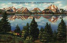 an old postcard with mountains and trees in the foreground, water reflecting them