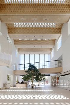 a large open space with high ceilings and lots of windows