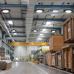 an empty warehouse with lots of wooden boxes