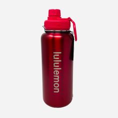 a red water bottle with the words union on it and a black cap is shown