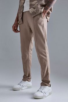 For a trendy outfit that offers comfort and practicality, choose joggers. Who said you can't make a style statement with a casual getup? Inject some street chic into your off-duty wardrobe with a pair of men's joggers from our unrivalled collection. Whether you are after the ultimate casual combo or you are just on the hunt for a pair of comfy sweatpants for your down time, our selection has you covered. Need some style inspo? Team your jogging bottoms with a plain hoodie and a denim jacket. For something a bit more on the smart side, combine a coat with black joggers and smart trainers. Sporty Cotton Joggers For Elevated Casual, Spring Casual Elevated Joggers, Sporty Spring Joggers For Elevated Casual Wear, Urban Relaxed Fit Spring Joggers, Urban Fall Joggers For Leisure, Casual Tapered Leg Joggers For Streetwear, Urban Style Sweatpants For Spring Leisure, Sporty Sweatpants For Elevated Casual Spring, Urban Spring Loungewear Joggers