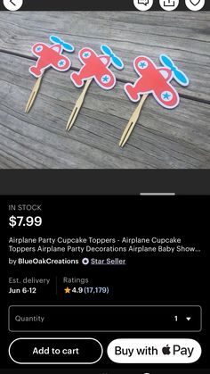 three red and blue airplane cupcake toppers on toothpicks with price tag