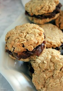 some cookies are sitting on a white plate