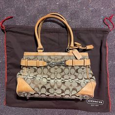 Never Used! In Great Condition Casual Coach Bags In Coated Canvas, Coach Bucket Bag With Top Carry Handle, Casual Travel Satchel With Branded Hardware, Casual Coach Satchel For Shopping, Casual Coach Tote Satchel, Casual Travel Bag With Branded Hardware, Casual Coach Bags With Leather Handles, Bags Coach, Coach Bags