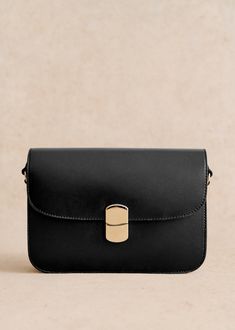 Piece made in our Italian atelier;Cross-body bag;Smooth leather exterior;Cotton lining;Adjustable Leather handle (press studs on each side to extend the handle);Brass clasp with light gold finish;Length of handle: 33 cm / 13 in shoulder, 50 cm / 19.7 in, cross body;Worn on the shoulder and crossbody;Closing by a metal clasp;Zipped pocket and patch pocket inside;Weight of the bag: 0,54 kg / 19 oz;Dimensions : 17x24x4,5cm / 6.7x9.4x1.8 in Effortless Spring Outfit, Europe 2024, Popular Handbags, Spring Capsule Wardrobe, Natural Heritage, Python Print, Classic Bags, One Bag, Parisian Style