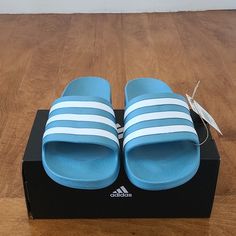 Denim Blue Colored Adidas Sandals. Size 7 Women, Would Fit Someone Who Wears A Size 8 Regularly In Women Shoes. Color Is A Bit Brighter In The Pictures. It Is Really More Of A Blue Jean Color. Blue Round Toe Slippers For Summer, Casual Blue Slippers For Beach, Blue Non-slip Sandals For Summer, Blue Flat Slippers For Summer, Blue Slippers For Spring Vacation, Casual Blue Flat Flip Flops, Casual Light Blue Slip-on Slippers, Casual Light Blue Non-slip Sandals, Casual Blue Slide Slippers