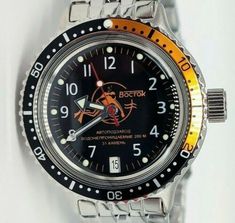 Brand New men's mechanical automatic watch Vostok Amphibia 2416 Scuba dude Diver Black & Orange 420380Brand new watchMovement: mechanical automatic caliber "Vostok 2416" with 31 ruby stones (hand winding and automatic winding system, date)Stainless steel case and braceletScrew down crown and case backModified bezelCase diameter (without the crown): 40 mm18 mm bracelet widthWater Resistance: 200 m (20 ATM)With original packagingInternational track number will be provided.Estimated delivery time a Vostok Amphibia, New Watch, Ruby Stone, Watch Movement, Mechanical Watch, Automatic Watch, New Man, Black Orange, Diver