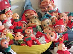 a bowl full of small figurines sitting on top of a table