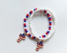 American Flag Colors Memory Wire Bracelet With Silver or Golden Charms - Etsy Patriotic White Jewelry For 4th Of July, Patriotic White Stretch Bracelet With Round Beads, Patriotic White Stretch Bracelet, Adjustable White Bracelet For 4th Of July, Patriotic White Jewelry With Colorful Beads, Patriotic Multicolor Stretch Bracelet For 4th Of July, White Beaded Jewelry For Independence Day, Adjustable White Patriotic Beaded Bracelets, Patriotic Beaded Bracelets For Independence Day