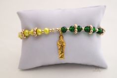 The Saint Jude's Good Fortune Protection Bracelet is a symbol of good luck, prosperity, and protection when it's worn on the wrist. This strong and powerful bracelet not only has a Saint Jude medallion but also has green, yellow, and white crystal beads to bring more good luck and fortune into your life. It's perfect for people of all faiths and traditions. Saint Jude is the Patron of Lost Causes. This protection bracelet with meditation beads will empower your mind, body, and soul. With healing Smudging Feathers, Catholic Bracelet, Saint Jude, Crystal Bath, Meditation Beads, Candle Carving, Hand Bells, Crystal Angels, Crystal Tree