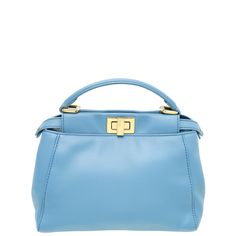 Material: Blue Leather Hardware: Gold Features: Pockets: Interior Zipper Pocket, Interior Flat Pocket Bag style: Shoulder Bag / Top Handle Closure type: Turn Lock Closure on Sides Serial Number / Stamp / Date Code: 8BN244 - K4P - 169 - 8007 Measurement in inches: W x D x H Inclusions: Wrong Dust Bag Condition: Used in good condition – 7 out of 10 Exterior: good condition, with few scratches on the hardware, scratches on corners and showing normal signs of use. Interior: very good condition, with few spots on leather and showing normal signs of use. Luxury Blue Pouch Satchel, Evening Blue Satchel With Gold-tone Hardware, Blue Bags With Gold-tone Hardware For Errands, Luxury Blue Bag With Zipper Closure, Blue Peekaboo, Ysl Shoes, Jimmy Choo Sunglasses, Leather Hardware, Number Stamps