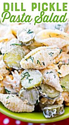 a green bowl filled with potato salad on top of a red and white table cloth