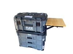 two plastic storage boxes sitting next to each other on top of a wooden table and bench