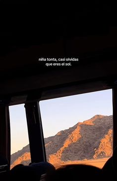 the view from inside a bus looking out at mountains and hills with a quote written on it