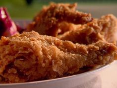 some fried food in a white bowl on a table