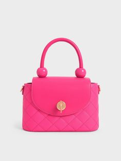 Summer calls for bright and bold colours — and our round quilted bag definitely fits the bill. From its eye-catching fuchsia finish to its sculptural top handle and quilted finish, this bag is made for the modern fashionista. Plus points for the small-but-roomy interior that provides ample space to fit all your daily essentials while the turn-lock closure keeps them securely in place. Create a visual contrast by matching it with a psychedelic print top and skirt set for a Y2K-inspired look. Purse Aesthetic, Expensive Bag, Quilted Top, Circle Bag, Top And Skirt Set, Cute Handbags, Luxury Purses, Fancy Bags, Dior Handbags