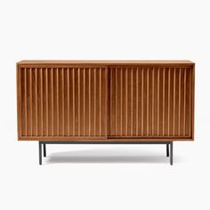 the sideboard is made from wood and has metal legs