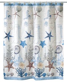 a shower curtain with shells and starfishs on it