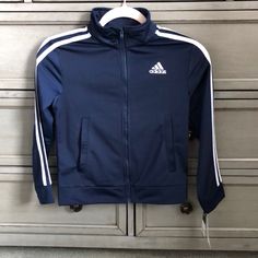 Navy Blue Zip Up Track Jacket With Pockets. Never Worn. Hooded Blue Outerwear For School, Sporty Navy Outerwear For School, Navy Adidas Long Sleeve Track Jacket, Adidas Navy Long Sleeve Track Jacket, Blue Adidas Track Jacket For Winter, Adidas Blue Track Jacket For Winter, Sporty Navy Adidas Outerwear, Navy Adidas Outerwear For Sports, Navy Adidas Sports Outerwear