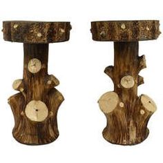 two wooden sculptures made to look like tree stumps