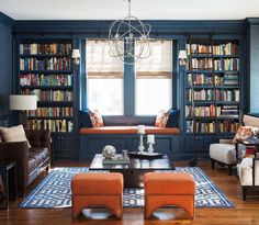 a living room filled with furniture and bookshelves