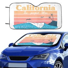 a blue car parked in front of a california sign