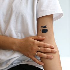 a person with a tattoo on their arm