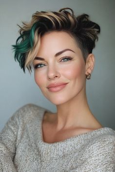 Click for More ➡️ | Save for Later ❤️  A bold undercut with a longer top layer, this pixie cut is daring and stylish. Emerald green tips add a unique, eye-catching detail. (Undercut Pixie with Emerald Green Tips - Pixie Hairstyles For Women Over 40) Pixie Money Piece, Pixie With Colored Tips, Pixie Green Hair, Short Hair Dye Ideas Pixie Cuts, Green Hair Short Pixie, Pixie Haircolor Ideas, Bleached Pixie Cut, Emerald Pixie Hair, Short Teal Hair