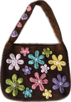 a crocheted purse with flowers and hearts on the front, hanging from a hook