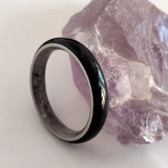 Nickel free ring, Black Tourmaline ring, Round band, Mens Amethyst band, Male rings, Male jewelry, Unisex ring, Womens engagement band. "Stone style" is the new 2022 collection of Woodlife jewelry The outside of the ring is made of Black Tourmaline Stone Powder, the inside of the ring is made of Natural Amethyst stone. Both materials are supported by a Titanium band, which ensures the quality of the ring. The ring in the photograph is 4mm wide. This can be customized. Customize your ring by choo Rings Marriage, Rings Male, Male Rings, Marriage Rings, Unisex Rings, Wedding Band Black, Male Jewelry, Stone Powder, Black Tourmaline Stone