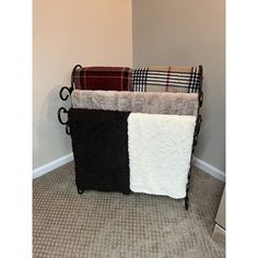 three towels are stacked on top of each other in the corner of a room with carpet