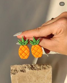 Cute pineapple earrings will add color to your day.A complete design earring in orange and green colors.  🎁Sent in the form of gift wrapping  If you want to write a note to your loved one📝, please write to me and I will gladly help you🙏🏻 📐Size:5*2Cm Whether you're dressing up for a special occasion or adding a playful flair to your everyday look, these earrings are versatile and chic. The vibrant colors and unique design make them a standout piece that will effortlessly transition from day to night, ensuring you look stylish and sophisticated at all times. Handmade with love, these earrings are not just an accessory, but a work of art that reflects your individuality and creativity. Hey there! I'm Ozlem, the one-woman show behind Clay By Ozlem Design. I create unique earrings that are Cute Pineapple, Pineapple Earrings, Orange Earrings, Handmade Earring, Statement Earring, Orange And Green, Unique Earrings, Designer Earrings, Earring Gifts