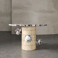 a marble table with three balls on it