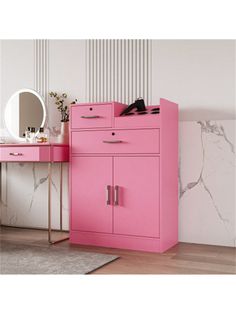 a pink dresser and mirror in a room