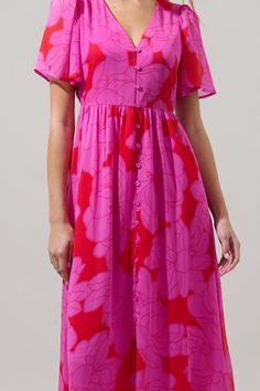 Expect lots of compliments when you wear the Zalea Floral Linana Button Front Maxi Dress! A bright pink floral motifs a red background on this long dress. It has short sleeves and a button placket in the front along with an adjustable belt around the waist. Add on some red heels and gold jewelry to go along. - V-neck- Belted- Button down- Puffed short sleeves- Color: Red PinkSize + Fit - Model is 5'11" and wearing size XS- Measurements taken from size S - Chest: 18 3/4"- Length: 56 1/4" Fabric S Button Front Maxi Dress, Striped Pant, Pink Floral Pattern, Red Heels, Mini Wrap Dress, Floral Romper, Floral Motifs, Adjustable Belt, Red Background