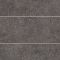 a tile floor with grey tiles on it