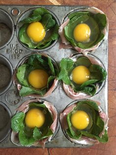 six muffin tins with eggs in them