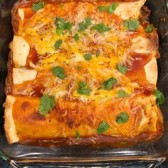 a casserole dish with meat, cheese and cilantro leaves on top