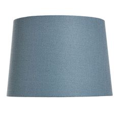 a blue lampshade on a white background with clippings to the bottom