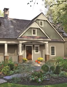 the front view of a house with landscaping around it