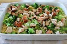 a casserole dish with chicken, broccoli and noodles