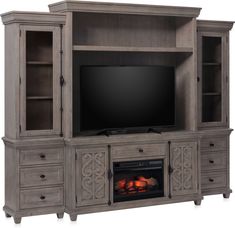 a large entertainment center with a fireplace in it