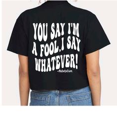 a woman wearing a black shirt that says, you say i'm a fool i say whatever