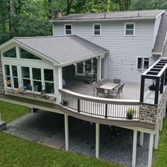 an aerial view of a house with deck and patio