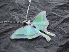 This stunning luna moth necklace is the perfect statement piece to add to your jewelry collection. Crafted with remarkable detail, the pendant features a delicate butterfly and green luna moth for a unique and compelling look. Whether you are looking for gifts for her or something special just for you, this butterfly charm necklace is sure to brighten up any outfit. Buy now and make a statement! Every butterflies was carefully cut from the silk organza fabric and handled by my hands. Each moth h Silk Organza Fabric, Moth Pendant, Moth Necklace, Delicate Butterfly, Luna Moth, For Her, Organza Fabric, Wedding Jewellery Necklace, Butterfly Charm