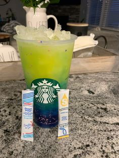 a starbucks drink with ice in it sitting on a counter