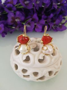 Elegant earrings with natural white baroque pearl and natural red Mediterranean coral, handcrafted gold-plated silver setting. Measures length 3 cm. Handmade Baroque Pearl Earrings For Gift, Handmade Yellow Gold Baroque Pearl Earrings, Red Pearl Drop Earrings As Gift, Red Pearl Drop Earrings For Gift, Red Drop Pearl Earrings For Gift, Handmade Yellow Gold Earrings With Baroque Pearls, Handmade Red Pearl Wedding Earrings, Handmade Red Pearl Earrings For Wedding, Elegant Coral Colored Red Coral Earrings