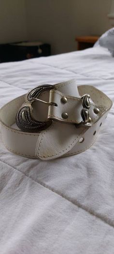 Lovely white leather belt with V shaped ornate brass coloured buckle. Belt white leather, belt cream leather, belt buckle, retro leather belt, white belt, white cowgirl belt, country leather belt, white country. length 93cm width 3.5cm Cowgirl Belt, Cowgirl Belts, Leather Belt Buckle, White Belt, Cow Girl, Suspender Belt, Buckle Belt, Teen Fashion Outfits, Brass Color