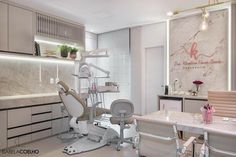 a dental office with white chairs and marble counter tops